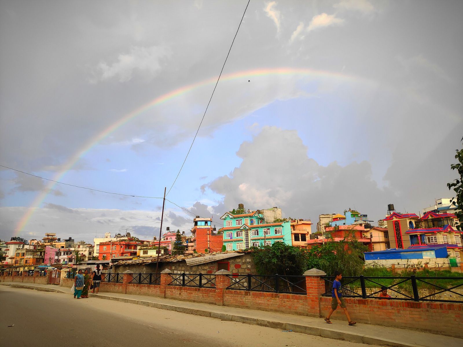 Houses in Kathmandu under a rainbow